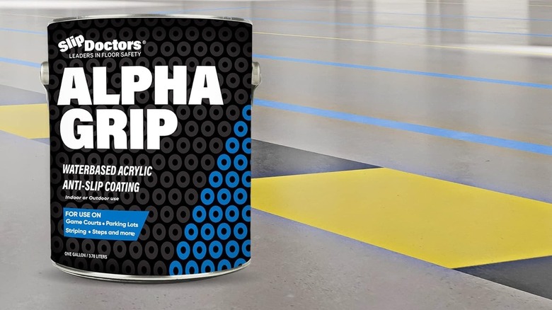 A can of Alpha Grip on the floor.
