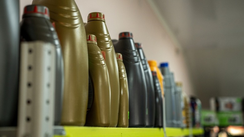 automotive fluids lined up on a shelf
