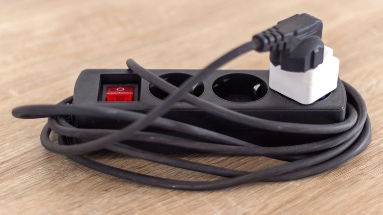 an extension cord on a wooden surface
