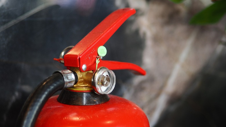 a fire extinguisher showing its pressure gauge