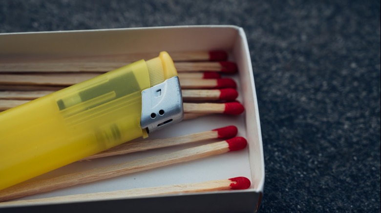 a lighter and a box of matches