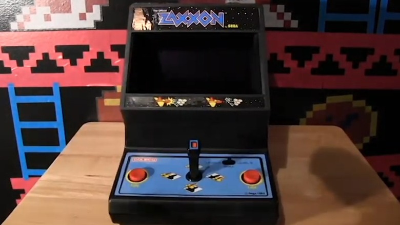 The Coleco Zaxxon handheld game sitting on a desk