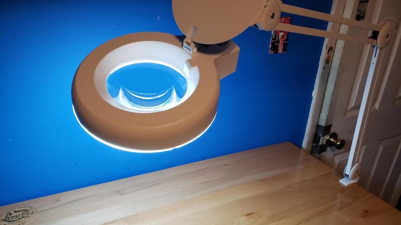 Harbor Freight Tools Fluorescent Magnifying Lamp attached to wooden desk