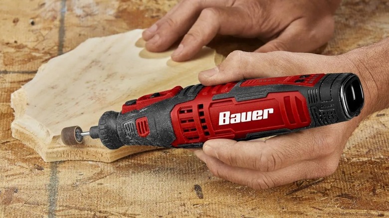 performing detail sanding with Bauer rotary tool