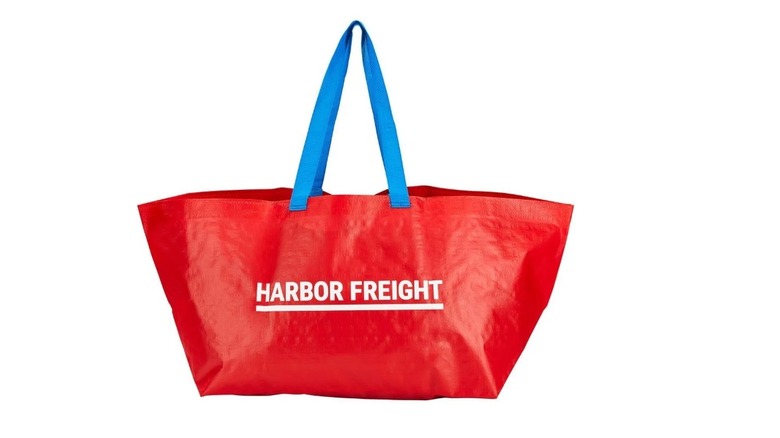 Stock image of a red bag with blue handle bearing the name Harbor Freight