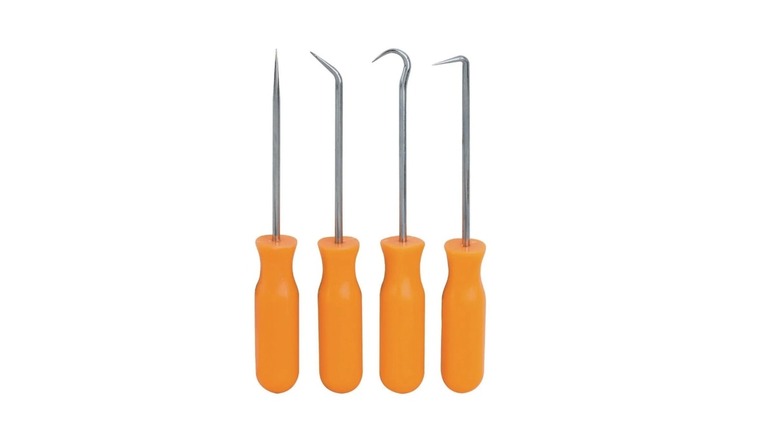 Stock image of four orange-handled hook-style picks
