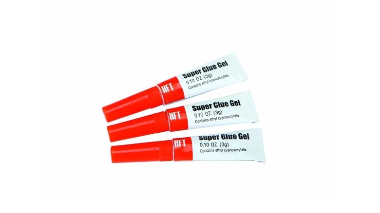 Stock image of three tubes of super glue gel