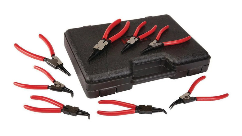 A bunch of Precision Snap Ring Pliers with a toolbox on a white background
