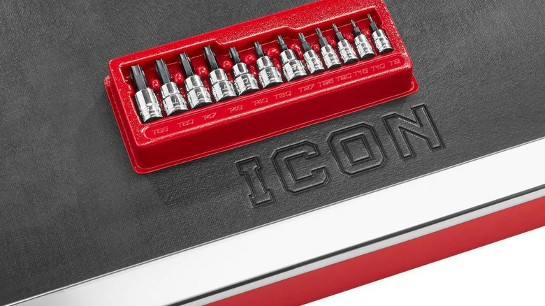 A red Professional TORX Bit Socket Set on a black and white surface, with the letters "ICON" spelled out under it
