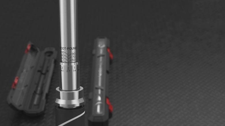 A drive torque wrench near its case.