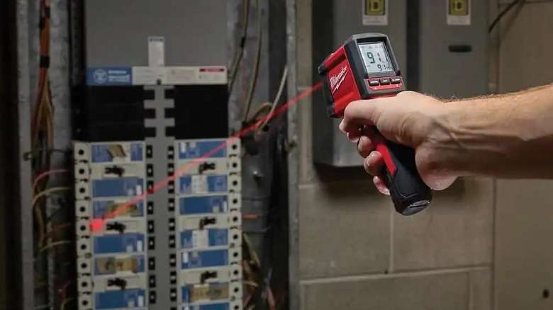 An infrared thermometer pointing at a server.