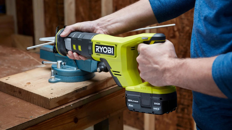 Ryobi reciprocating saw in use