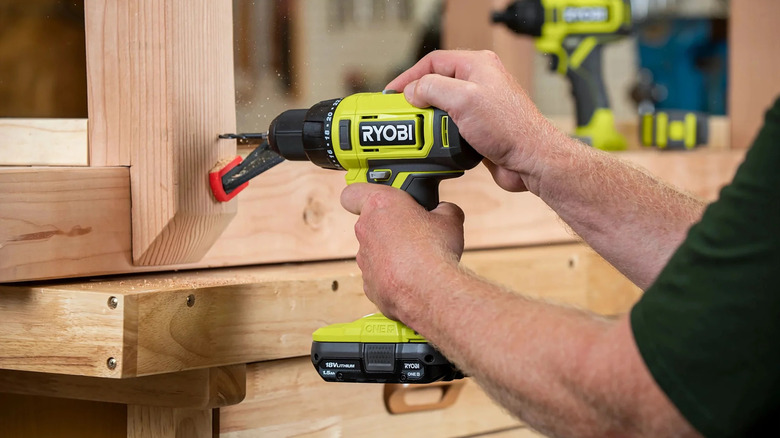 Ryobi 1/2 inch drill driver drilling a hole