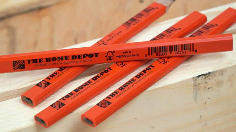 The Home Depot Oversized Carpenter Pencil on wood.