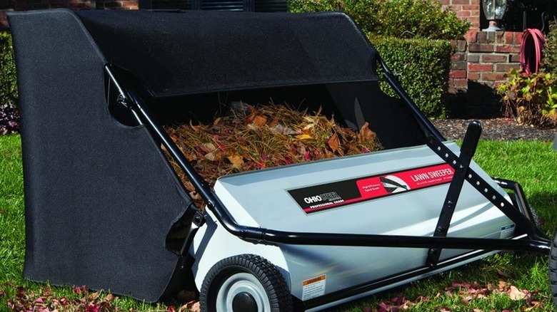 Lawn sweeper filled with leaves