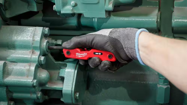 Maintenance technician using a Milwaukee hex key set
