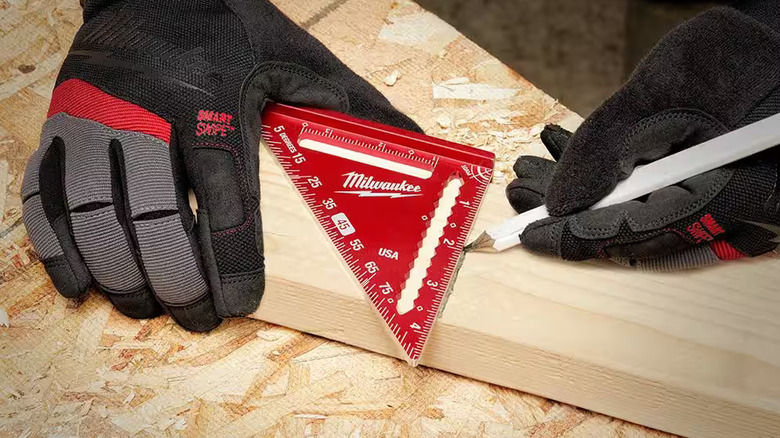 Person using a Milwaukee metal trim square