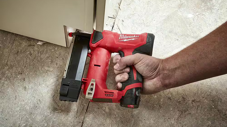 Man using the Milwaukee M12 during a home improvement project