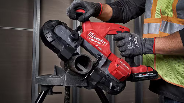 Worker using a Milwaukee M18 Fuel compact bandsaw