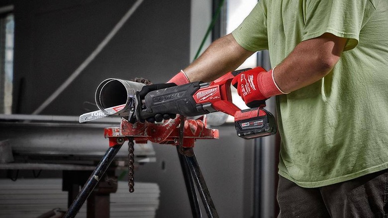Worker using a Milwaukee Sawzall