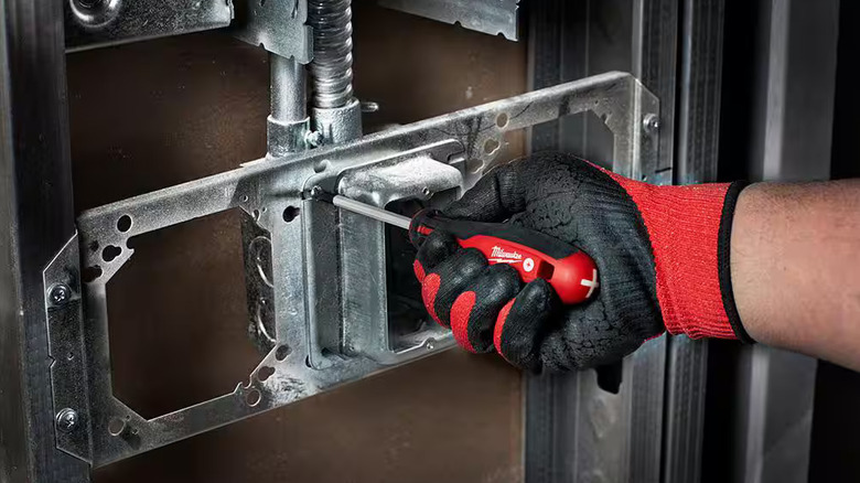 Tightening a screw with a Milwaukee screwdriver