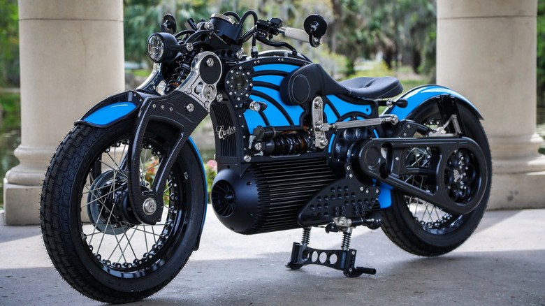 A Curtiss Motorcycle Co. motorcycle parked on concrete with pillars behind it