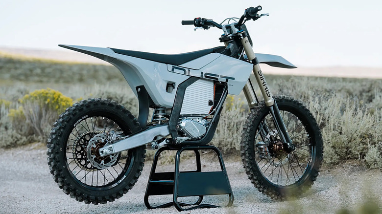 LiveWire Dust electric motorcycle on a center stand in a desert landscape