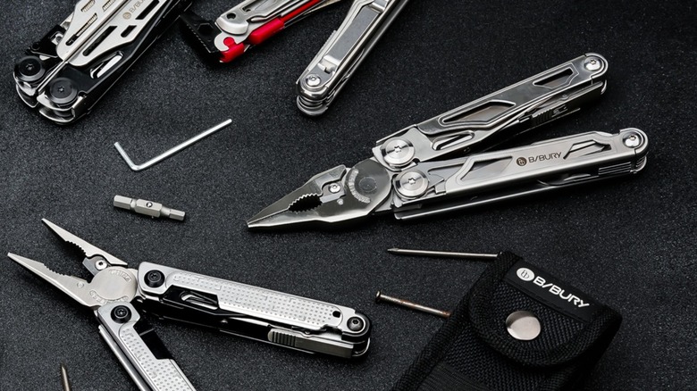 A few Bibury multi-tools displayed on black table