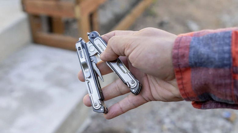 Man holding a Leatherman multi-tool