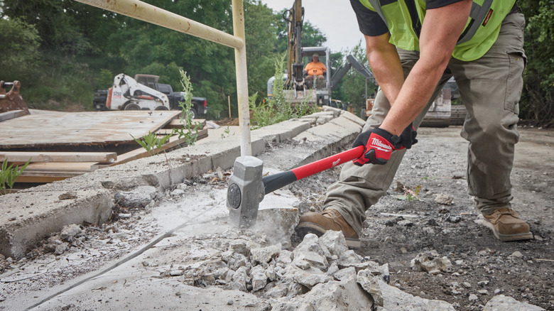 A Milwaukee sledge hammer in action.