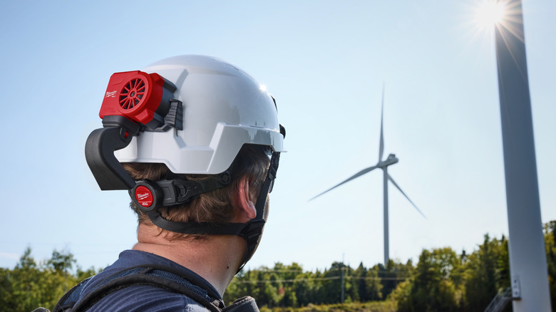 Worker wearing a Milwaukee cooling fan