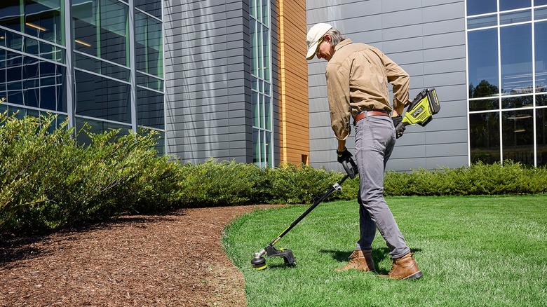 Ryobi 40V HP 17 inch attachment capable string trimmer in action