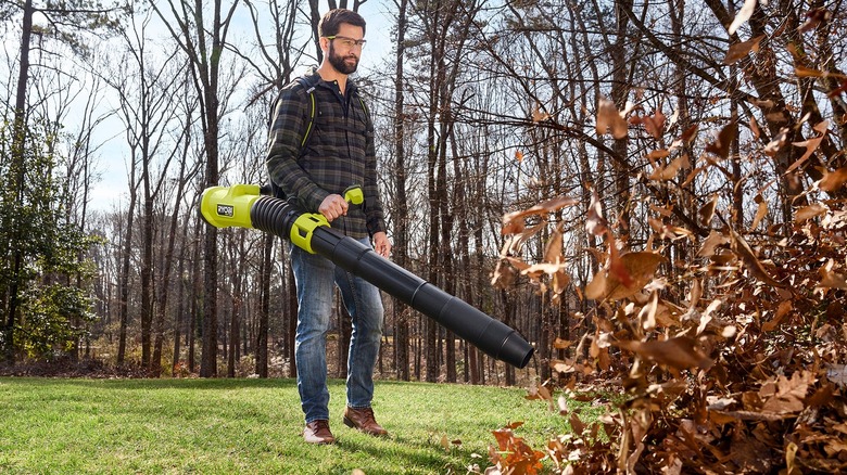 Ryobi 40V HP 850 CFM Whisper Series backpack blower blowing a pile of leaves