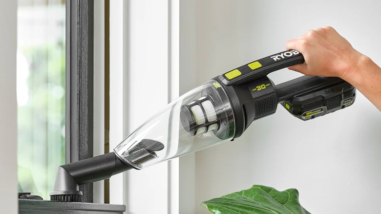 cleaning window with Ryobi vacuum