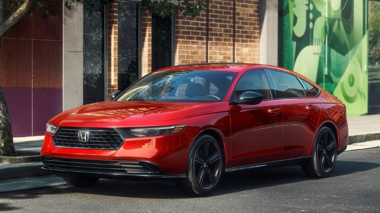 Red Honda Accord parked on an urban street