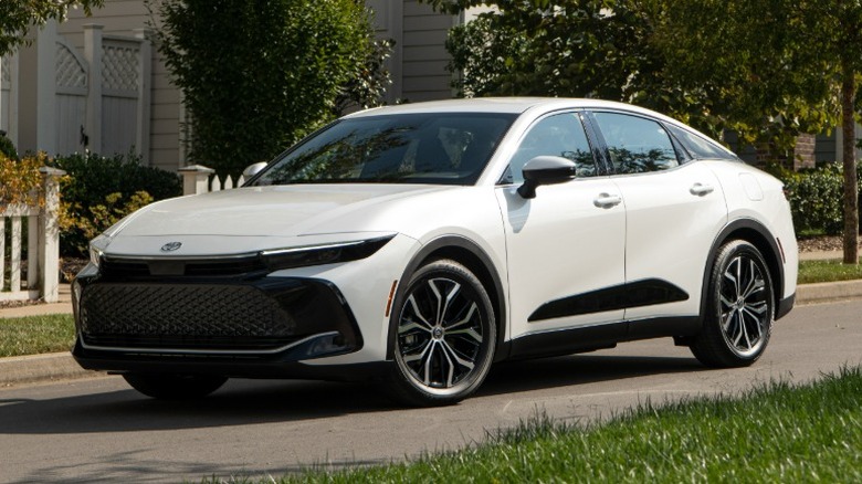 White Toyota Crown parked in a suburban neighbourhood.