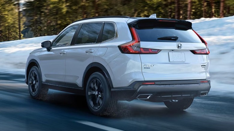 2025 Honda CR-V driving on road near snow