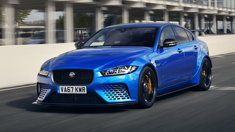 Blue Jaguar XE SV Project 8 on a racing track.