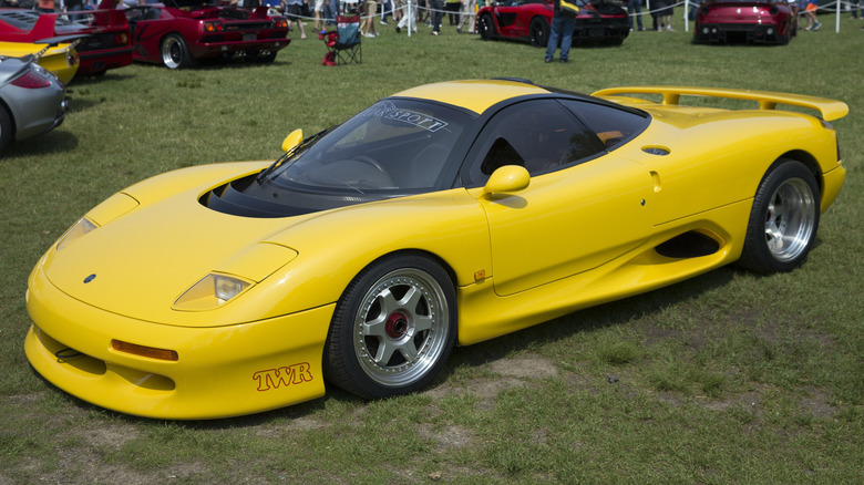 Jaguar XJR-15 on grass at a concours event.