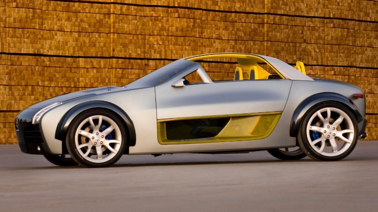 Side view of Nissan Urge concept against a red brick wall