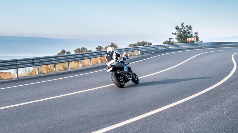 Motorcyclist driving on highway