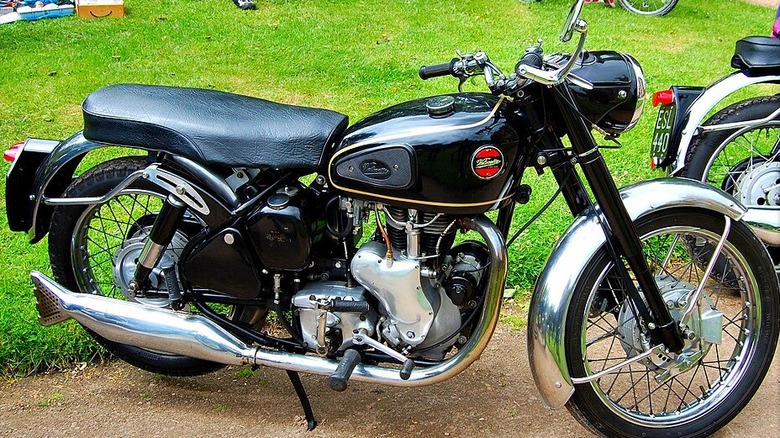 Vintage Velocette Venom motorcycle on grass.