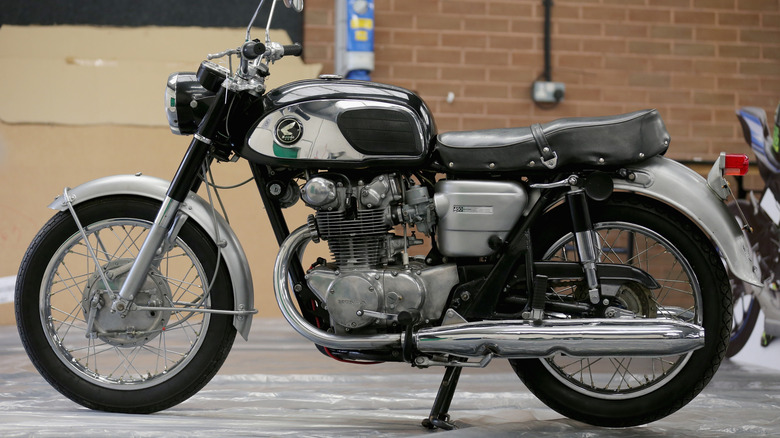 1967 Honda CB450 Black Bomber next to a building
