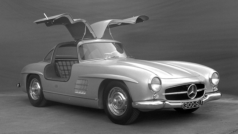an archival photo of the Mercedes-Benz 300SL with the gullwing doors open