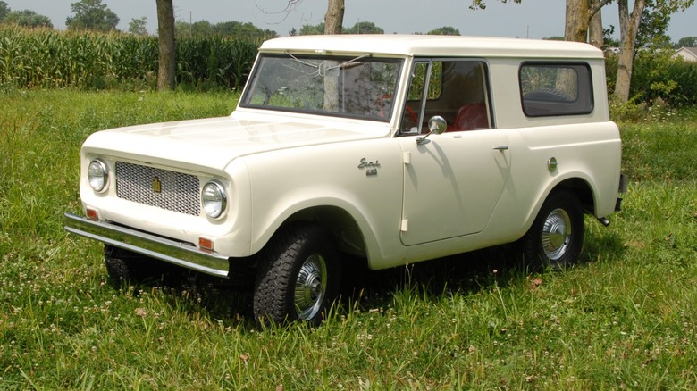 a white Scout parked on a field