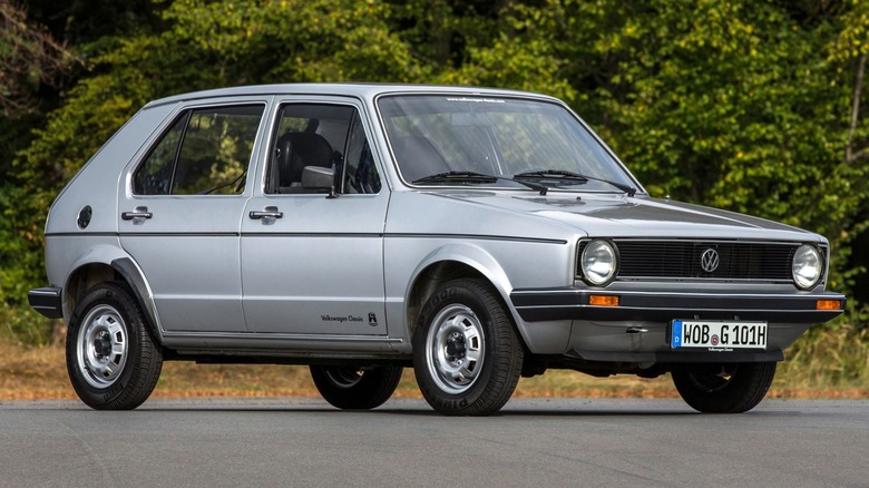 a gray first-generation Volkswagen Golf on a parking lot