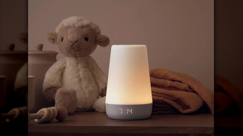 Night lamp in front of a teddy bar on a table