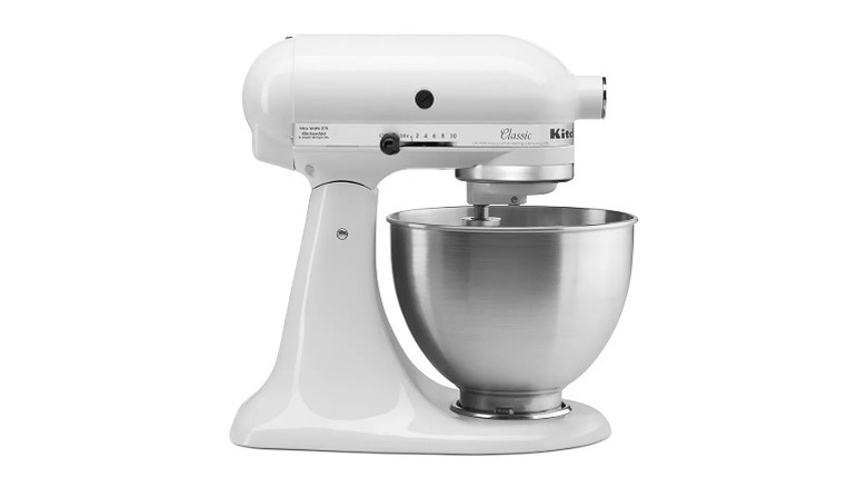 White stand mixer with a steel mixing bowl