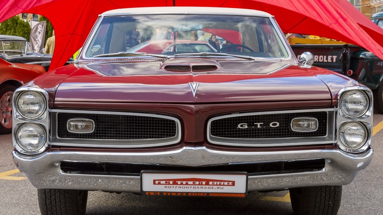 a 1964 Pontiac GTO at a car show
