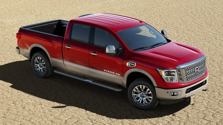 Red 2019 Nissan Titan XD heavy-duty truck on sand